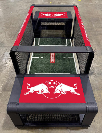 Red Bull New York branded SubSoccer S7 unit with custom red graphics and logo for sports marketing and fan events.