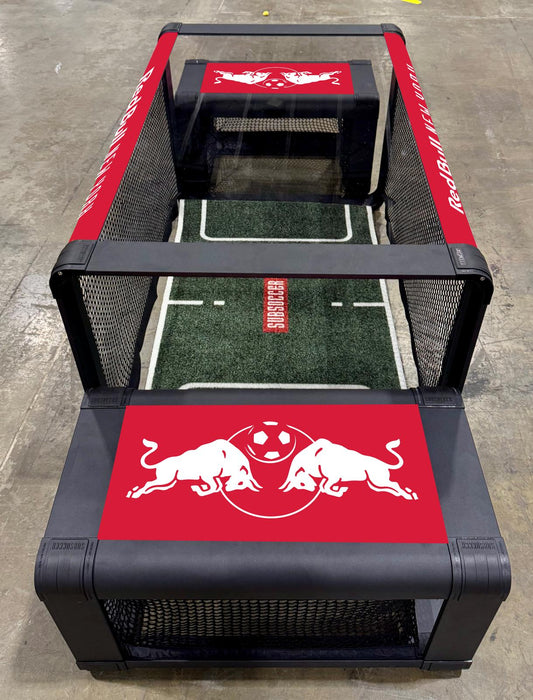 Red Bull New York branded SubSoccer S7 unit with custom red graphics and logo for sports marketing and fan events.
