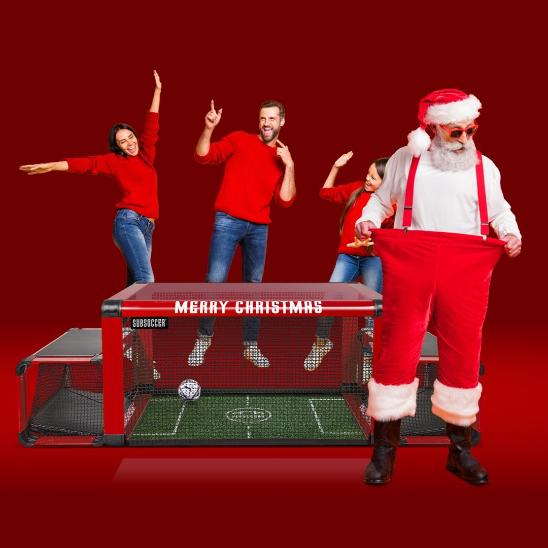 SubSoccer bench soccer game as a Christmas gift idea — festive photo with Santa and players in red