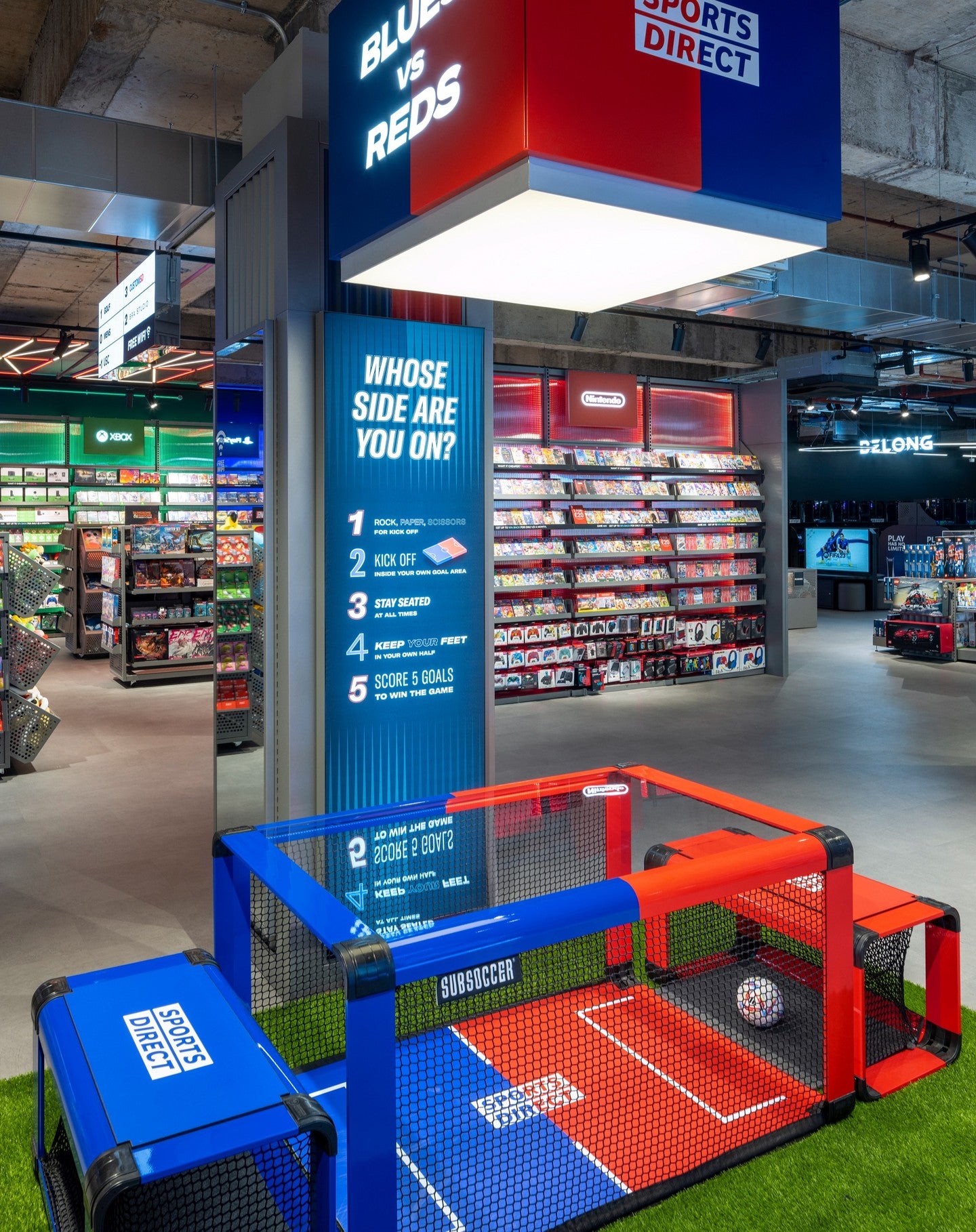 SubSoccer bench soccer table as a branded retail activation display inside a Sports Direct store